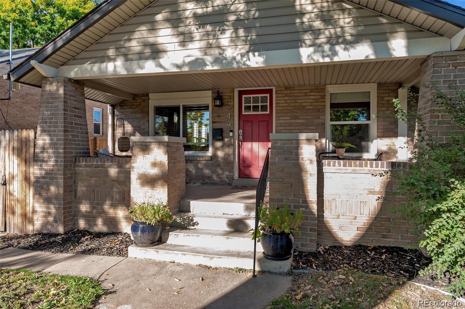 3649 Garfield Street Denver, CO 80205 - Photo 3 of 30 a front view of a house