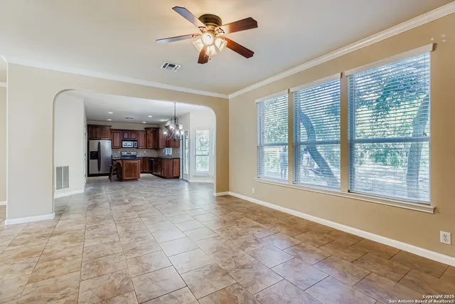 a view of livingroom with a ceiling fan and window