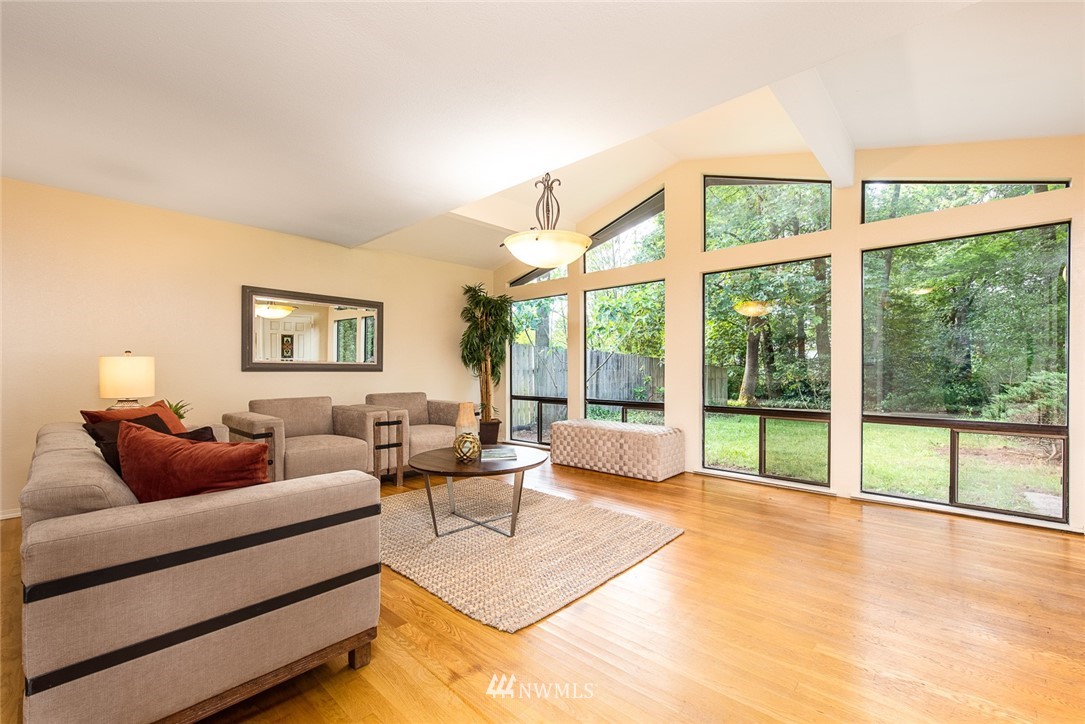 10044 Slater Avenue Northeast Kirkland, WA 98033 - Photo 2 of 21 a living room with furniture and a large window