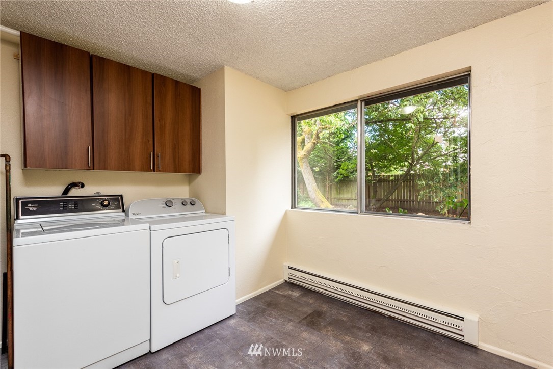 10044 Slater Avenue Northeast Kirkland, WA 98033 - Photo 17 of 21 a utility room with dryer and washer