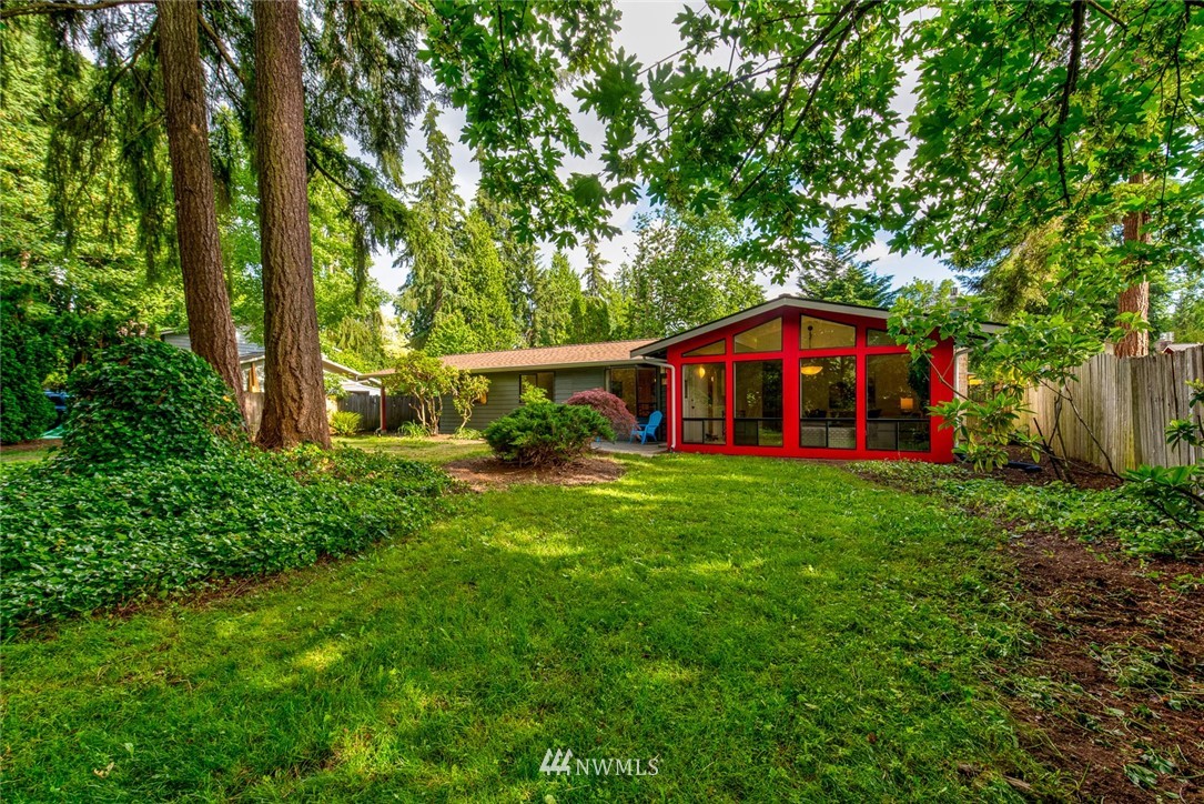 10044 Slater Avenue Northeast Kirkland, WA 98033 - Photo 18 of 21 a view of a house with backyard and sitting area