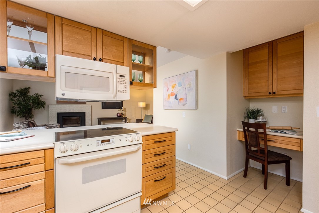 10044 Slater Avenue Northeast Kirkland, WA 98033 - Photo 8 of 21 a stove top oven sitting inside of a kitchen