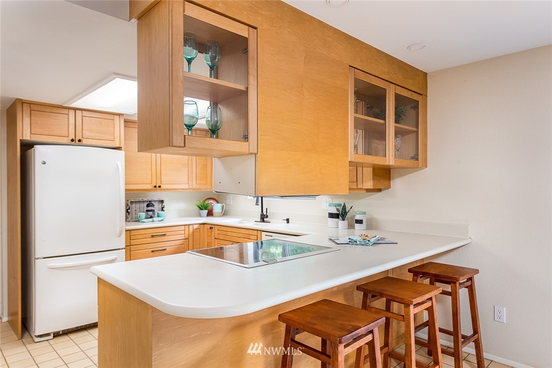 10044 Slater Avenue Northeast Kirkland, WA 98033 - Photo 9 of 21 a kitchen with a sink a refrigerator and a window