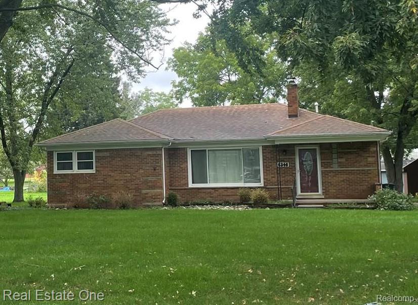 6346 Donaldson Road Troy, MI 48085 - Photo 1 of 8 Brick exterior with a shingled roof, front entry, and a large front window