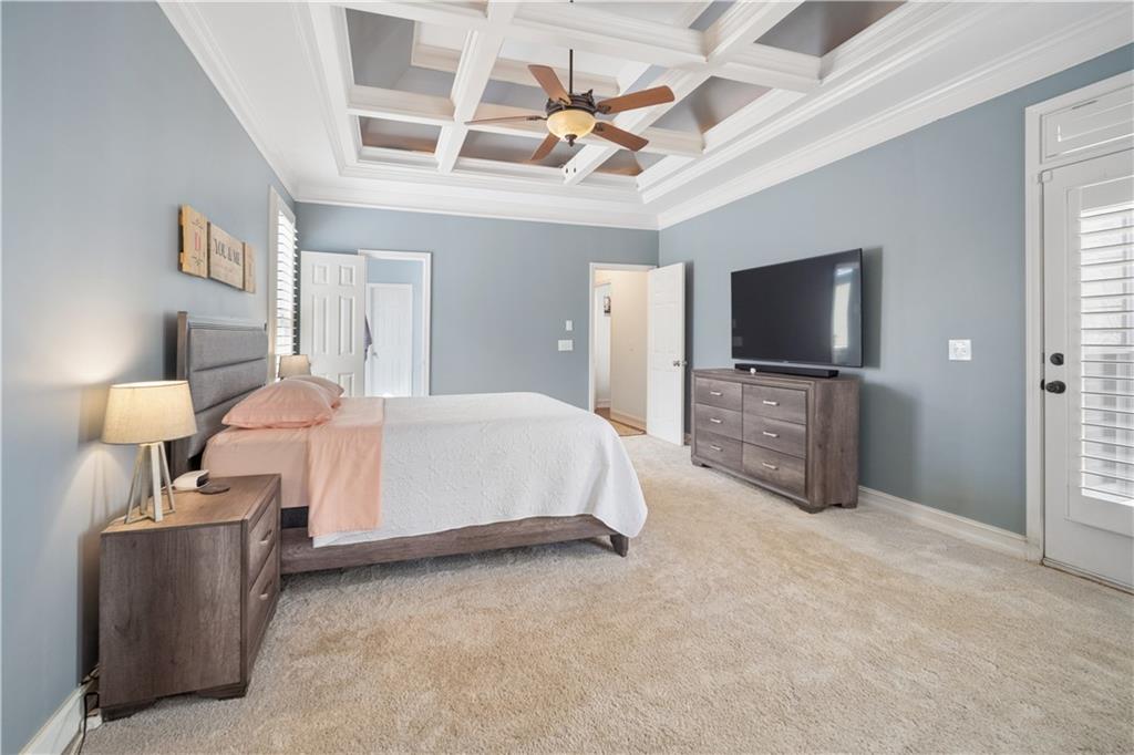 35 Waterstone Drive Southeast Cartersville, GA 30121 - Photo 29 of 58 a spacious bedroom with a bed and a flat screen tv