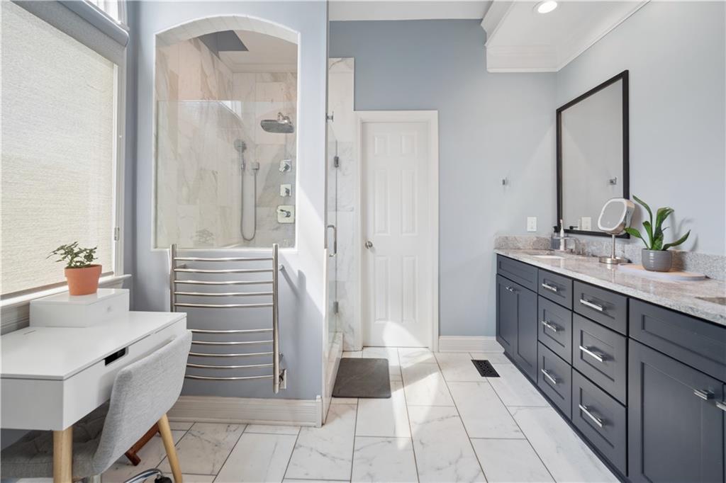 35 Waterstone Drive Southeast Cartersville, GA 30121 - Photo 33 of 58 a spacious bathroom with a double vanity sink a mirror and a shower