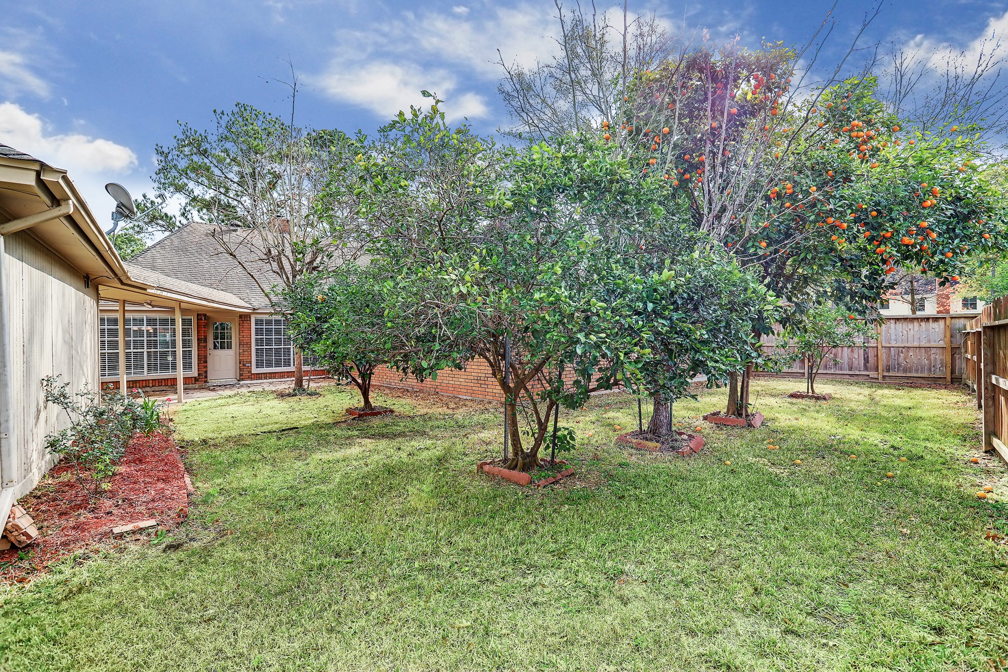 7403 Manor Bridge Court Houston, TX 77095 - Photo 11 of 11 a view of a backyard with table and chairs and potted plants