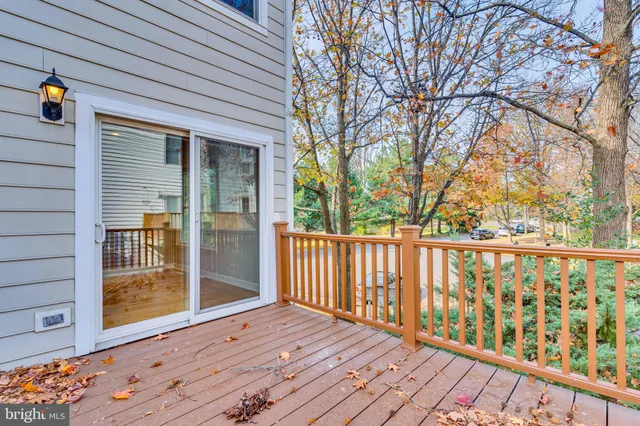 a view of a deck with wooden floor and wooden fence
