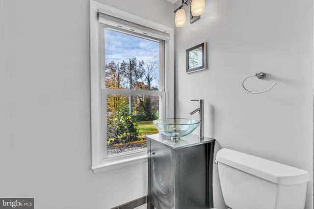 a bathroom with a toilet and a sink