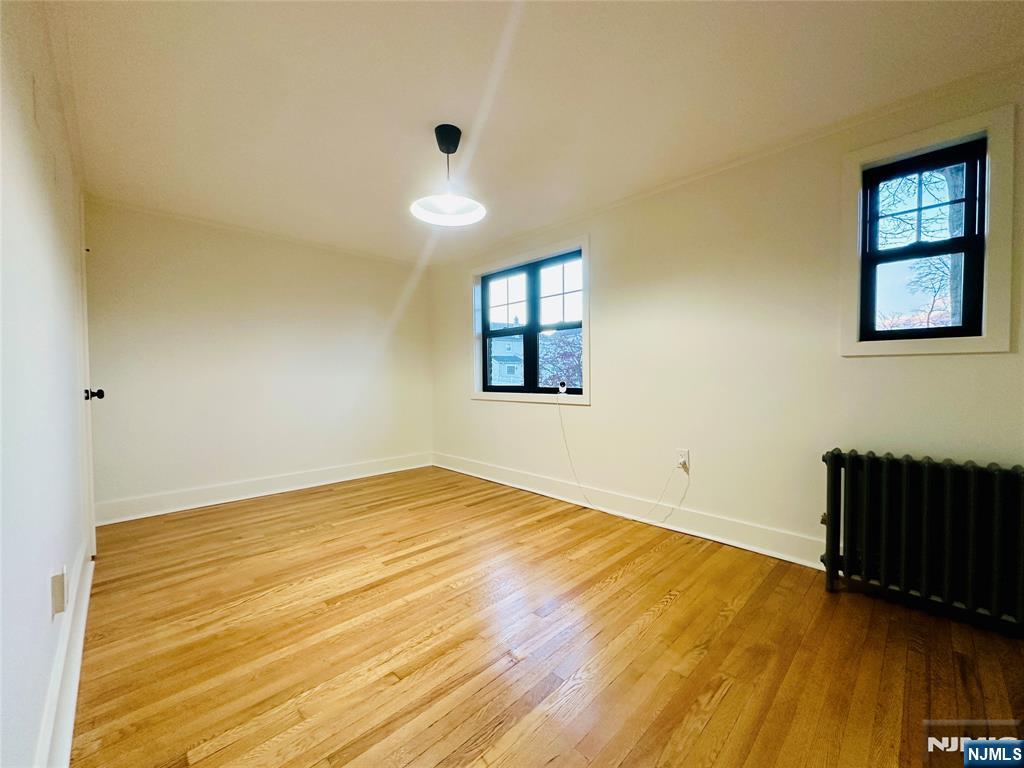 355 Valley Boulevard Wood-Ridge, NJ 07075 - Photo 17 of 24 a view of an empty room and wooden floor