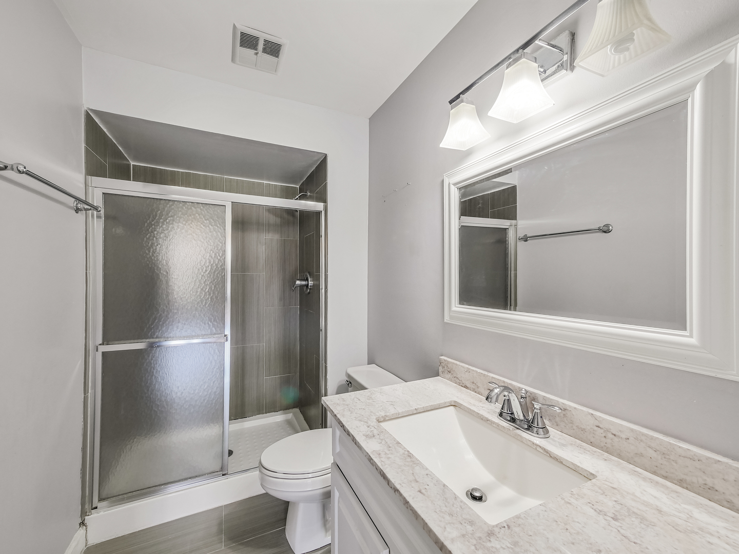 1747 West Crystal Lane, Unit 210 Mount Prospect, IL 60056 - Photo 14 of 33 a bathroom with a sink toilet and shower