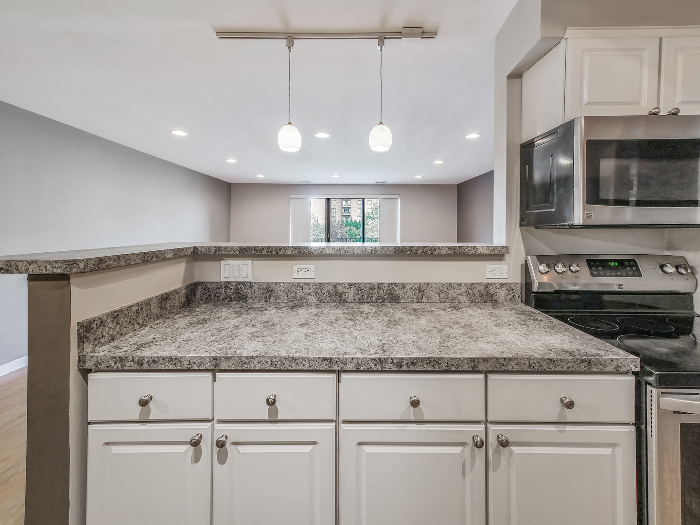 1747 West Crystal Lane, Unit 210 Mount Prospect, IL 60056 - Photo 18 of 33 a kitchen with a stove microwave and cabinets