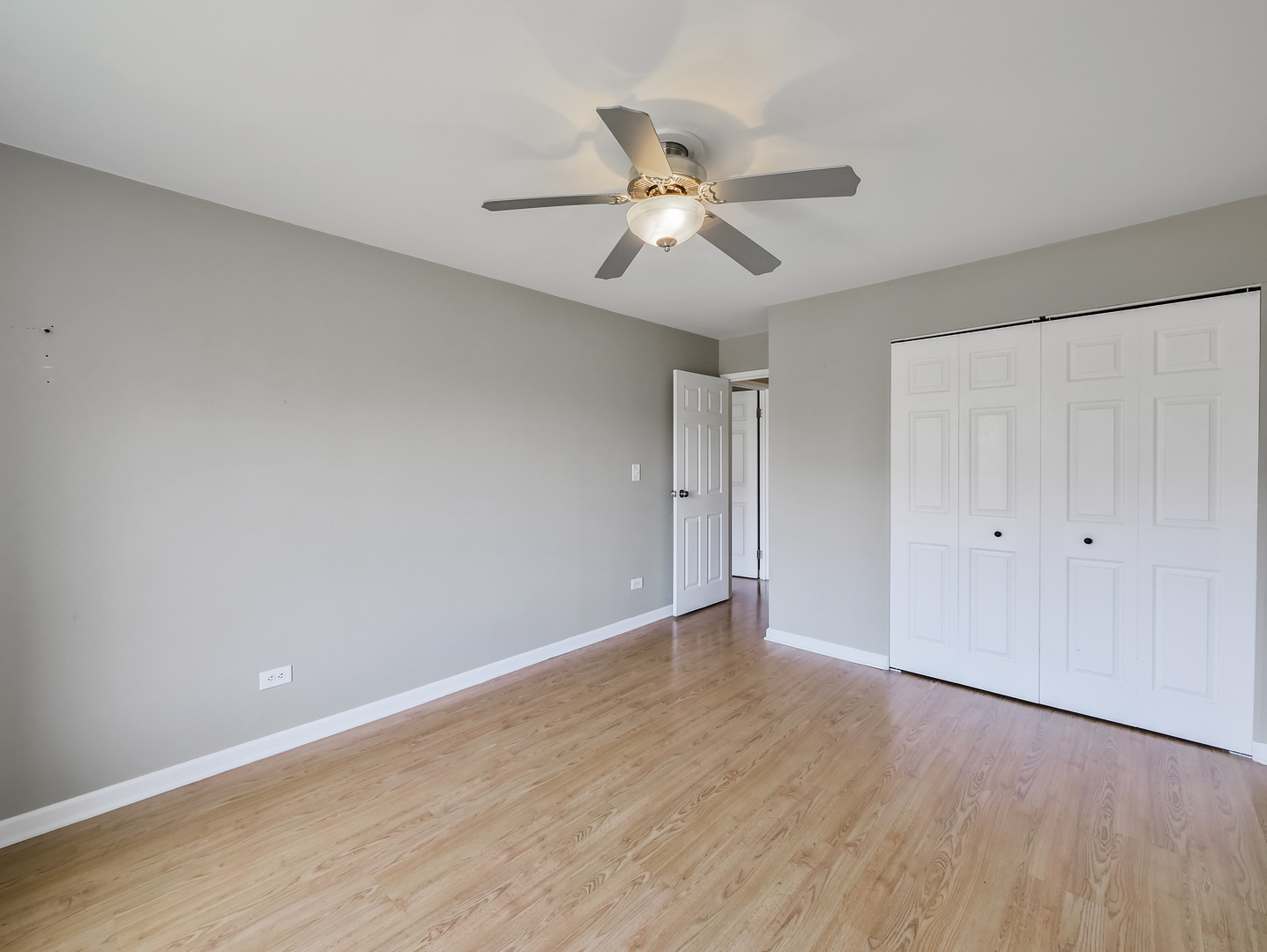 1747 West Crystal Lane, Unit 210 Mount Prospect, IL 60056 - Photo 19 of 33 a view of an empty room and wooden floor