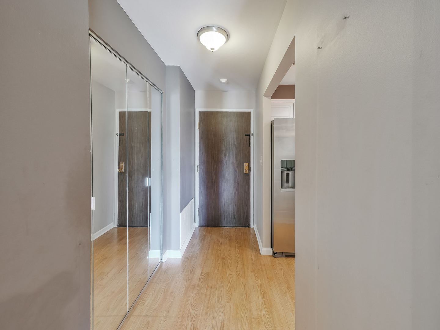 1747 West Crystal Lane, Unit 210 Mount Prospect, IL 60056 - Photo 21 of 33 a view of a hallway with wooden floor