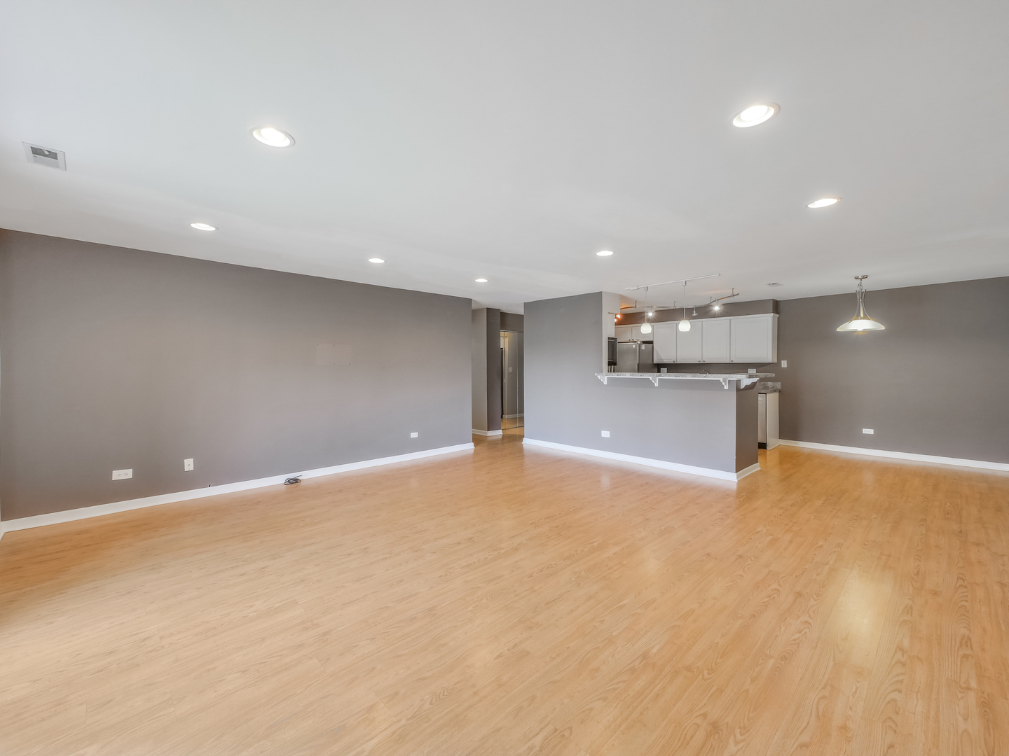 1747 West Crystal Lane, Unit 210 Mount Prospect, IL 60056 - Photo 22 of 33 a view of an empty room with a kitchen