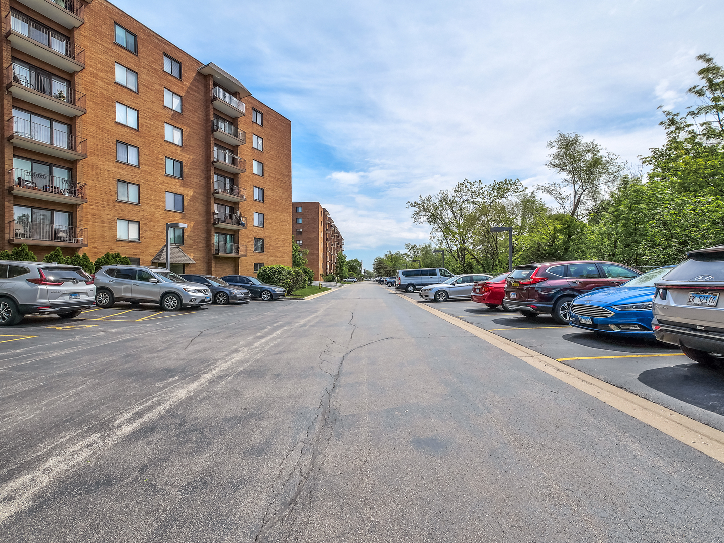 1747 West Crystal Lane, Unit 210 Mount Prospect, IL 60056 - Photo 3 of 33 a cars parked on the side of a street
