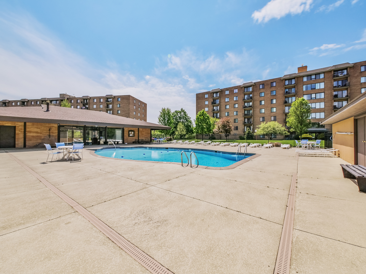 1747 West Crystal Lane, Unit 210 Mount Prospect, IL 60056 - Photo 31 of 33 a view of building with swimming pool and sitting area