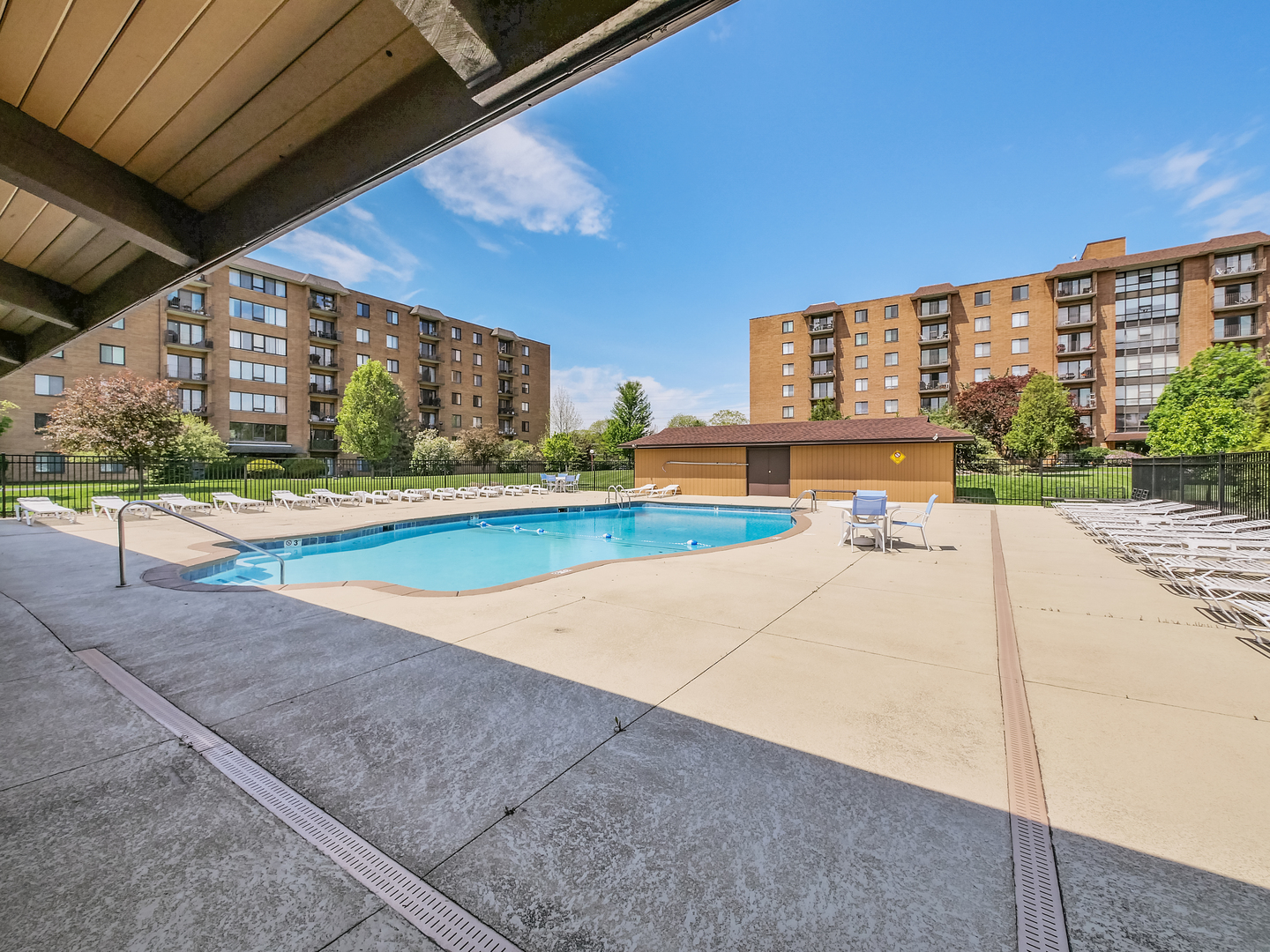 1747 West Crystal Lane, Unit 210 Mount Prospect, IL 60056 - Photo 32 of 33 a view of a swimming pool with an outdoor seating