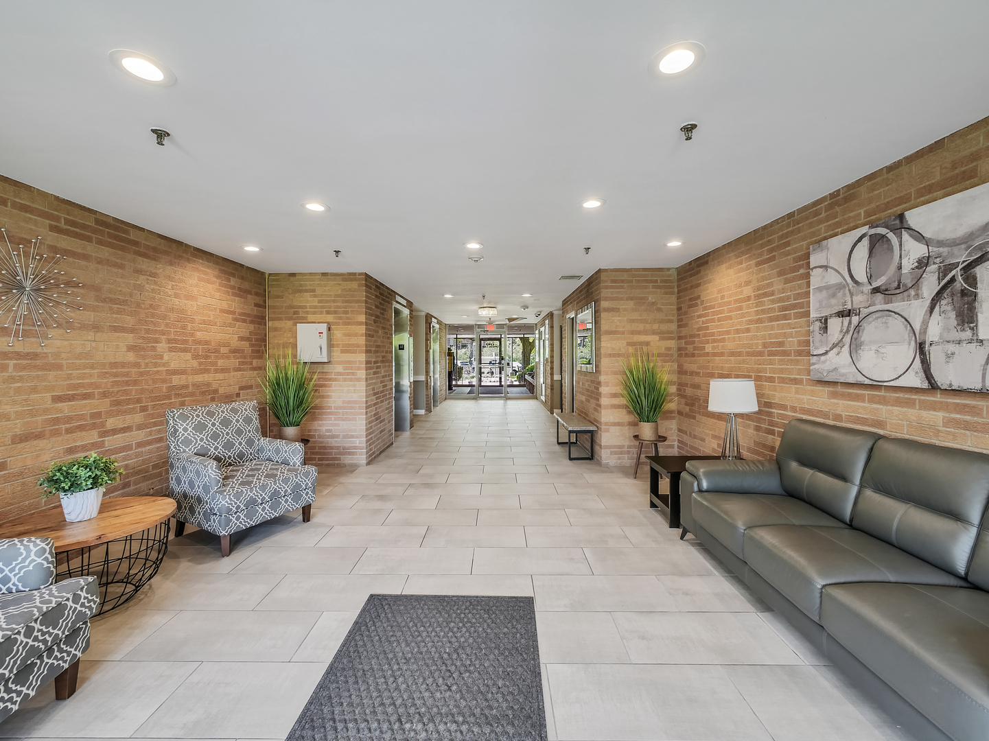 1747 West Crystal Lane, Unit 210 Mount Prospect, IL 60056 - Photo 5 of 33 a lobby with furniture and couches