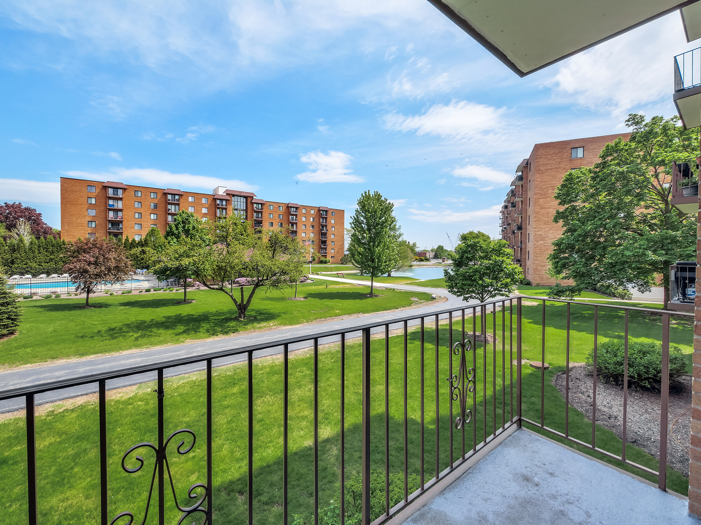 1747 West Crystal Lane, Unit 210 Mount Prospect, IL 60056 - Photo 7 of 33 a view of a balcony with a garden