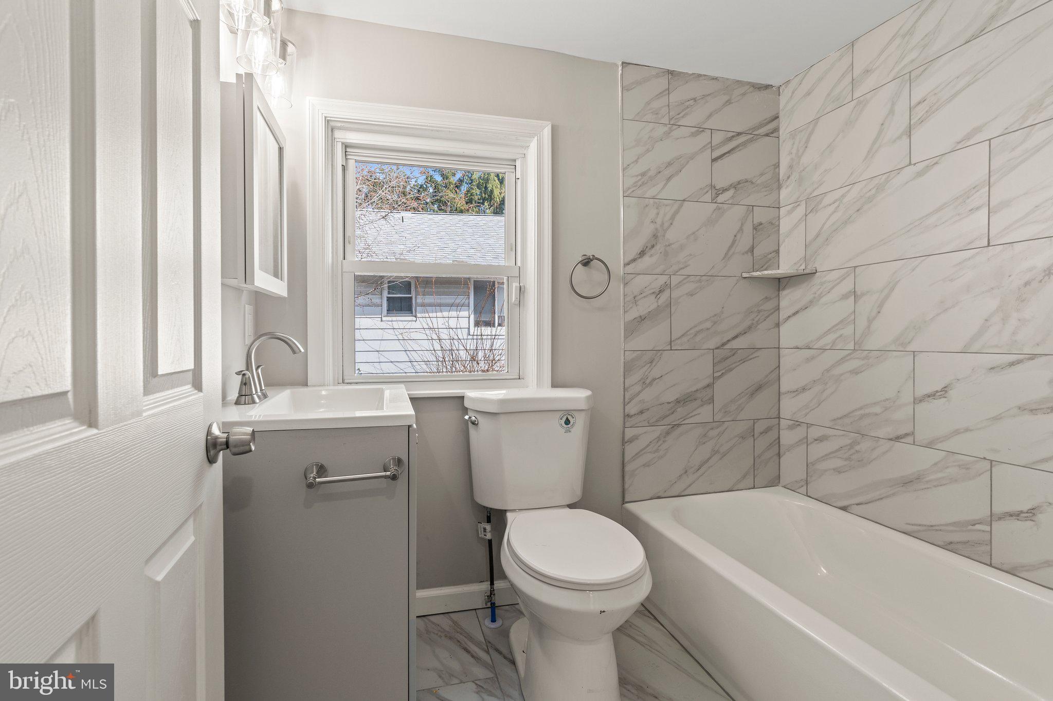 29 East 4th Street Burlington, NJ 08016 - Photo 21 of 27 a bathroom with a sink toilet and bathtub