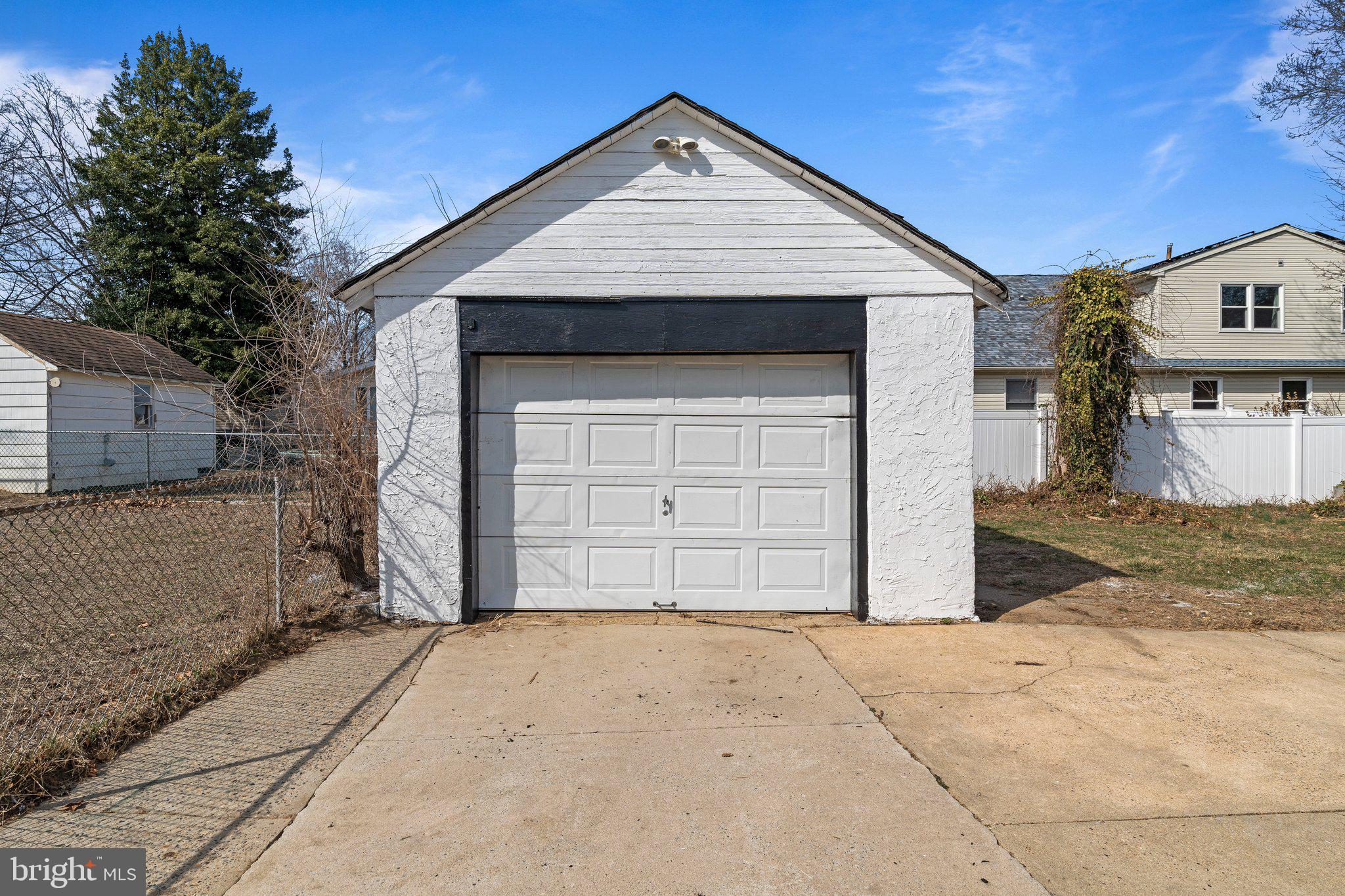 29 East 4th Street Burlington, NJ 08016 - Photo 24 of 27 a front view of a house with a yard and garage