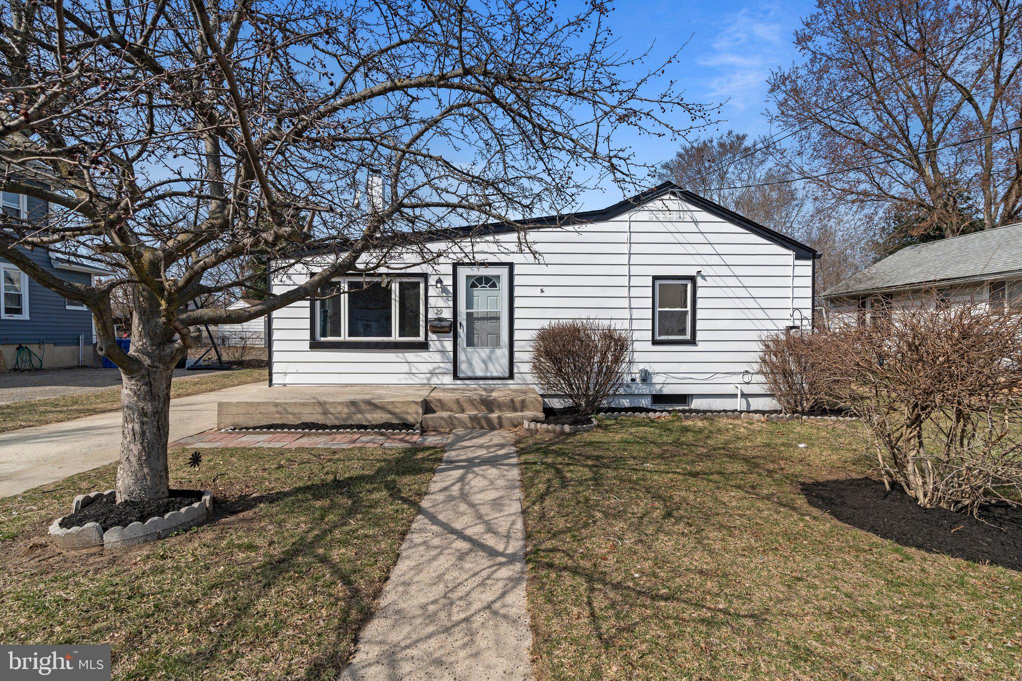 29 East 4th Street Burlington, NJ 08016 - Photo 3 of 27 a view of a house with backyard and trees