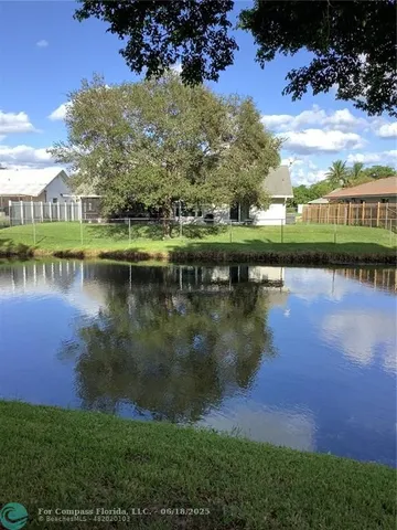 a view of a lake with a yard