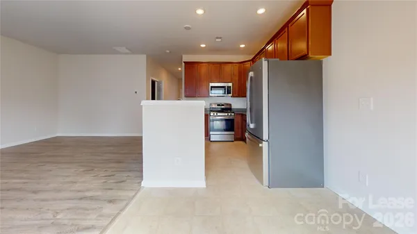 a view of kitchen and kitchen with a sink