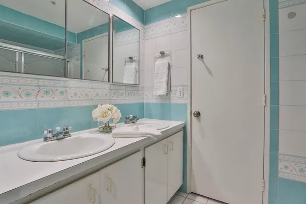 a bathroom with a sink and a mirror