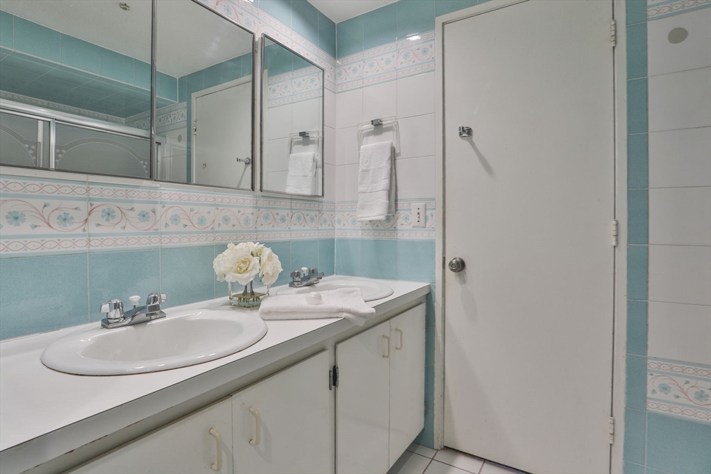 405 Great Elm Way, Unit 405 Acton, MA 01718 - Photo 14 of 19 a bathroom with a sink and a mirror