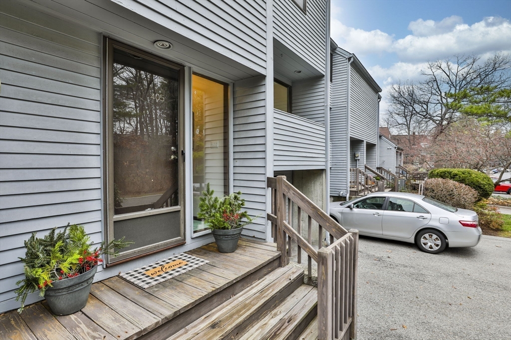 405 Great Elm Way, Unit 405 Acton, MA 01718 - Photo 3 of 19 a car parked in front of a house