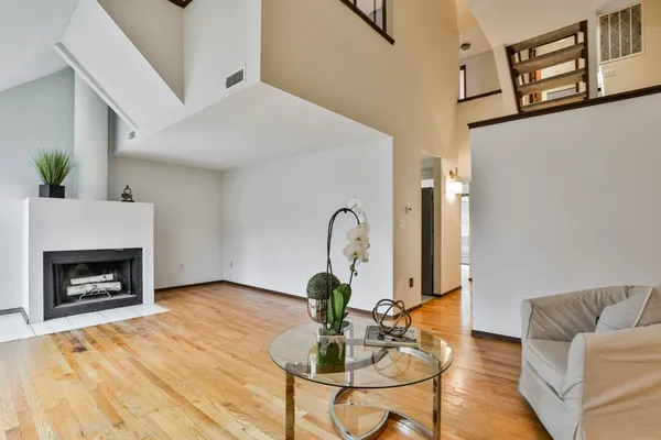 a living room with furniture and a fireplace