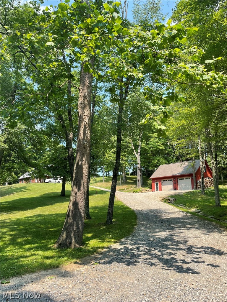 Inviting lane up to the garage and house