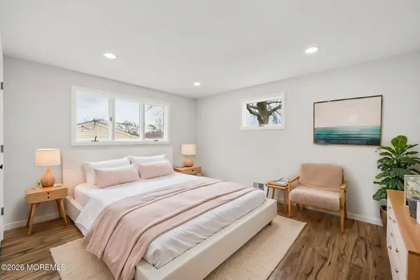 a bedroom with furniture and a window