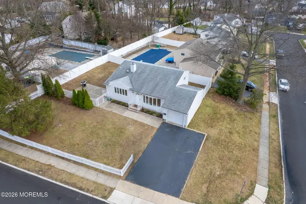 an aerial view of residential building and parking space