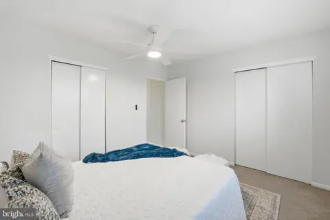 a bedroom with a bed and a closet