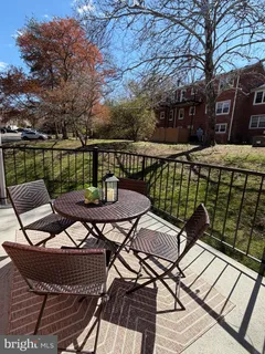 a view of a chairs and table on the deck