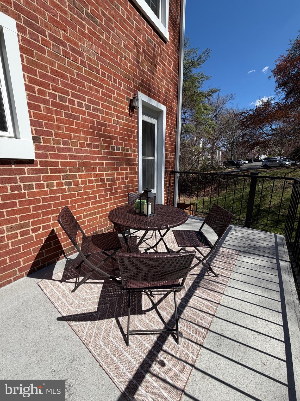4614 28th Road South, Unit B Arlington, VA 22206 - Photo 19 of 19 a view of a roof deck with table and chairs with wooden floor and fence