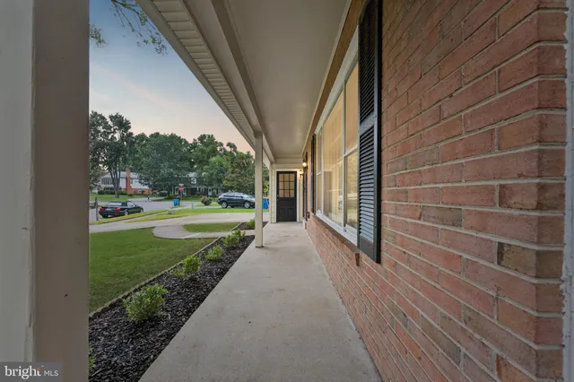 a view of a pathway both side of house