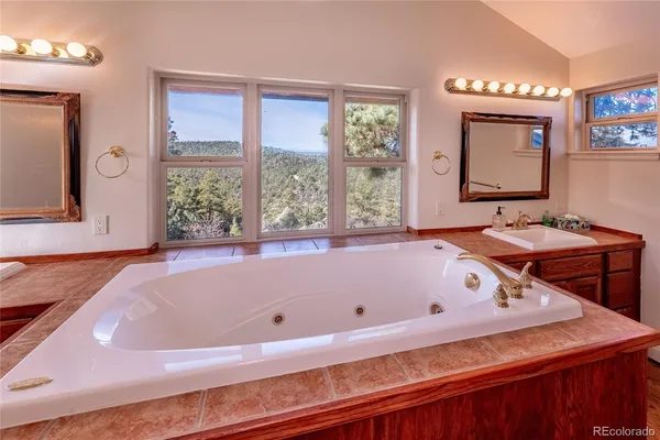 a bathroom with a bathtub and a sink