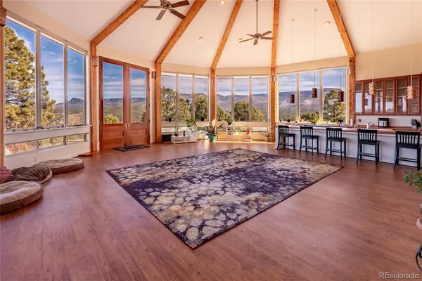 a living room with large windows