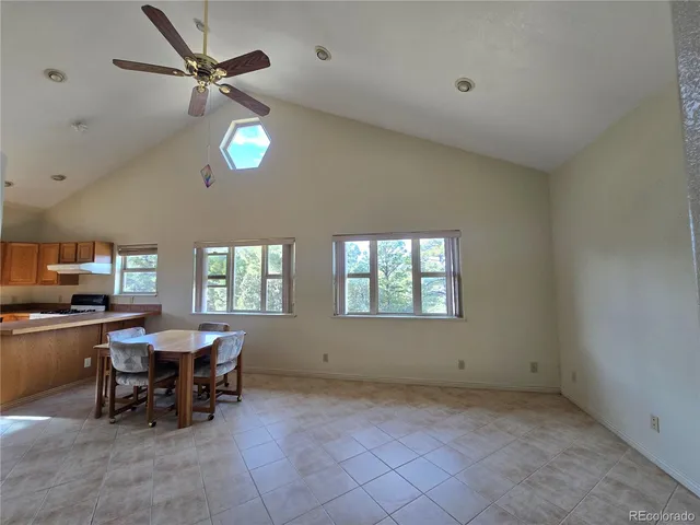 a view of a livingroom with furniture and a window