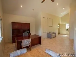 a bedroom with furniture and a lamp