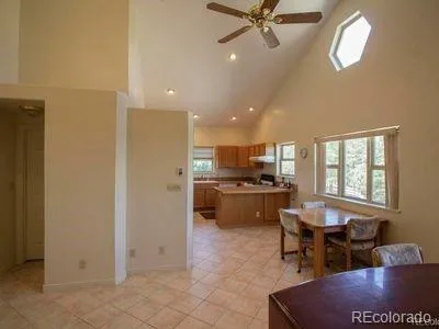 a kitchen with a refrigerator and a sink