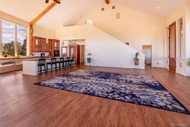 a view of a living room and kitchen