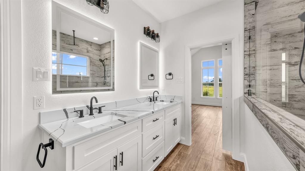 3451 Carraway Tbd County Road Paradise, TX 76073 - Photo 16 of 24 a spacious bathroom with double vanity and a mirror