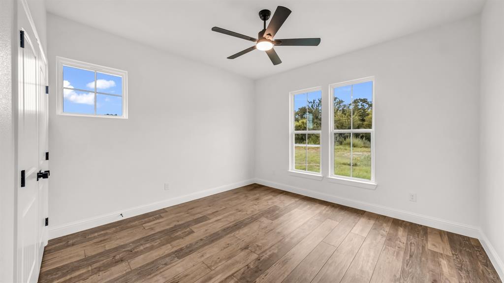 3451 Carraway Tbd County Road Paradise, TX 76073 - Photo 19 of 24 wooden floor in an empty room with a window