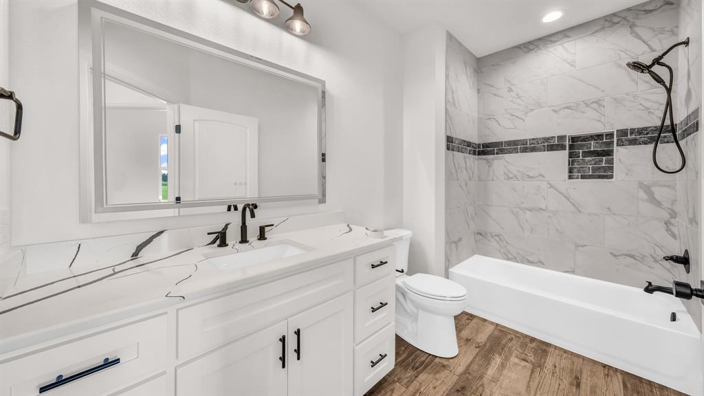 3451 Carraway Tbd County Road Paradise, TX 76073 - Photo 21 of 24 a bathroom with a granite countertop sink a toilet and a bathtub