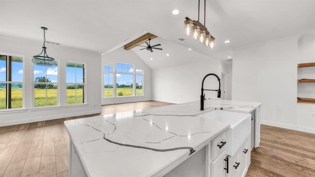 3451 Carraway Tbd County Road Paradise, TX 76073 - Photo 4 of 24 a kitchen with a sink a counter top space and living room view